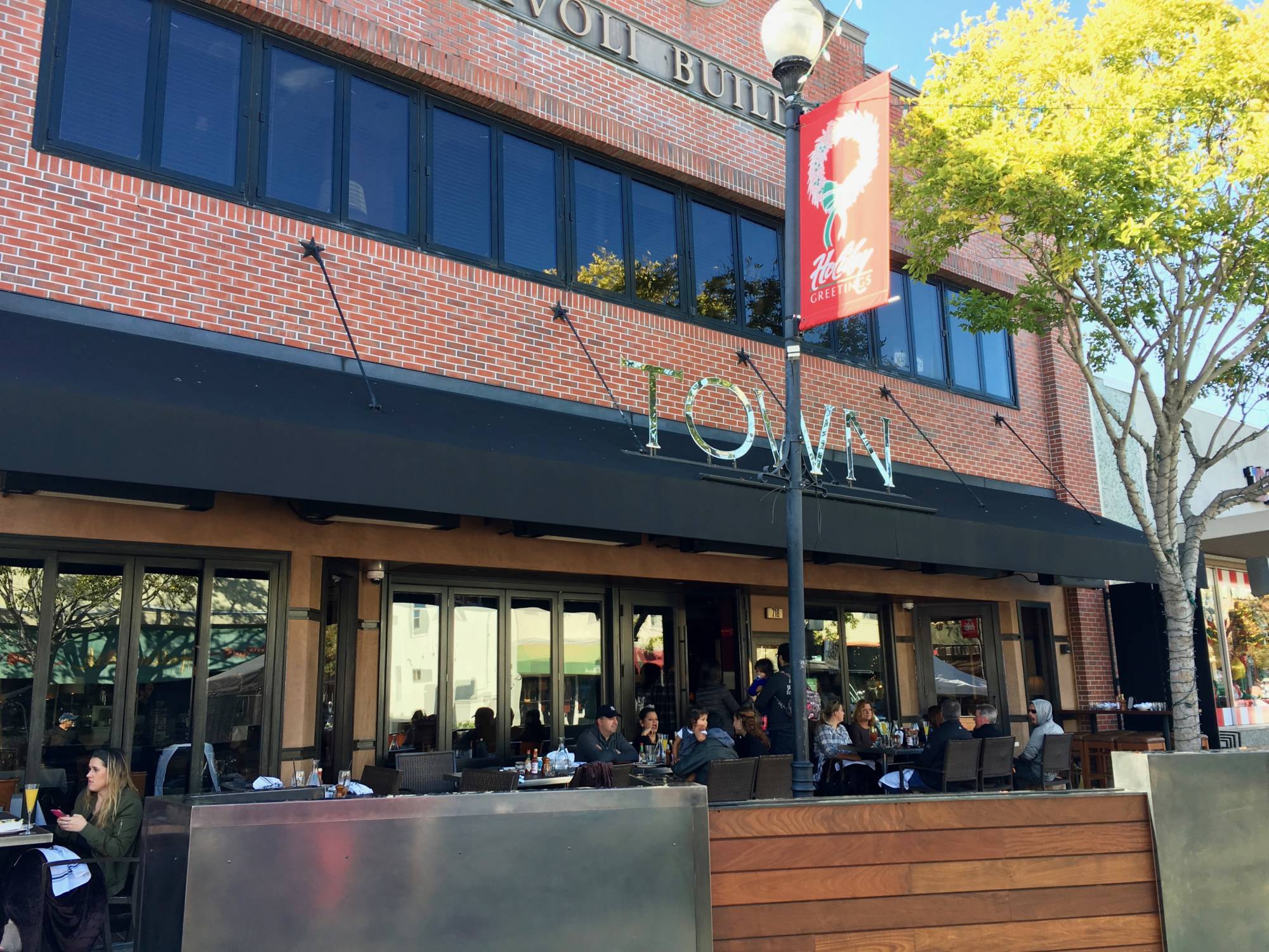 Guests having brunch on the patio at Town in San Carlos.
