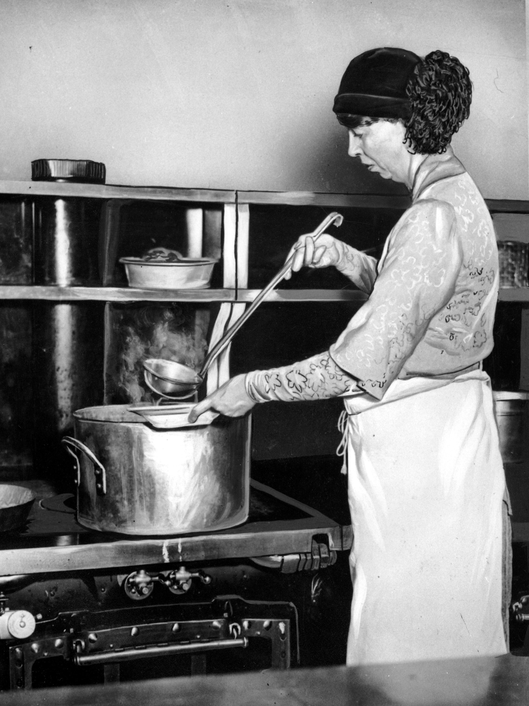 Eleanor Roosevelt ladles soup into a bowl to help feed unemployed women in the Grand Central Restaurant kitchen in New York City in 1932 during the Great Depression.