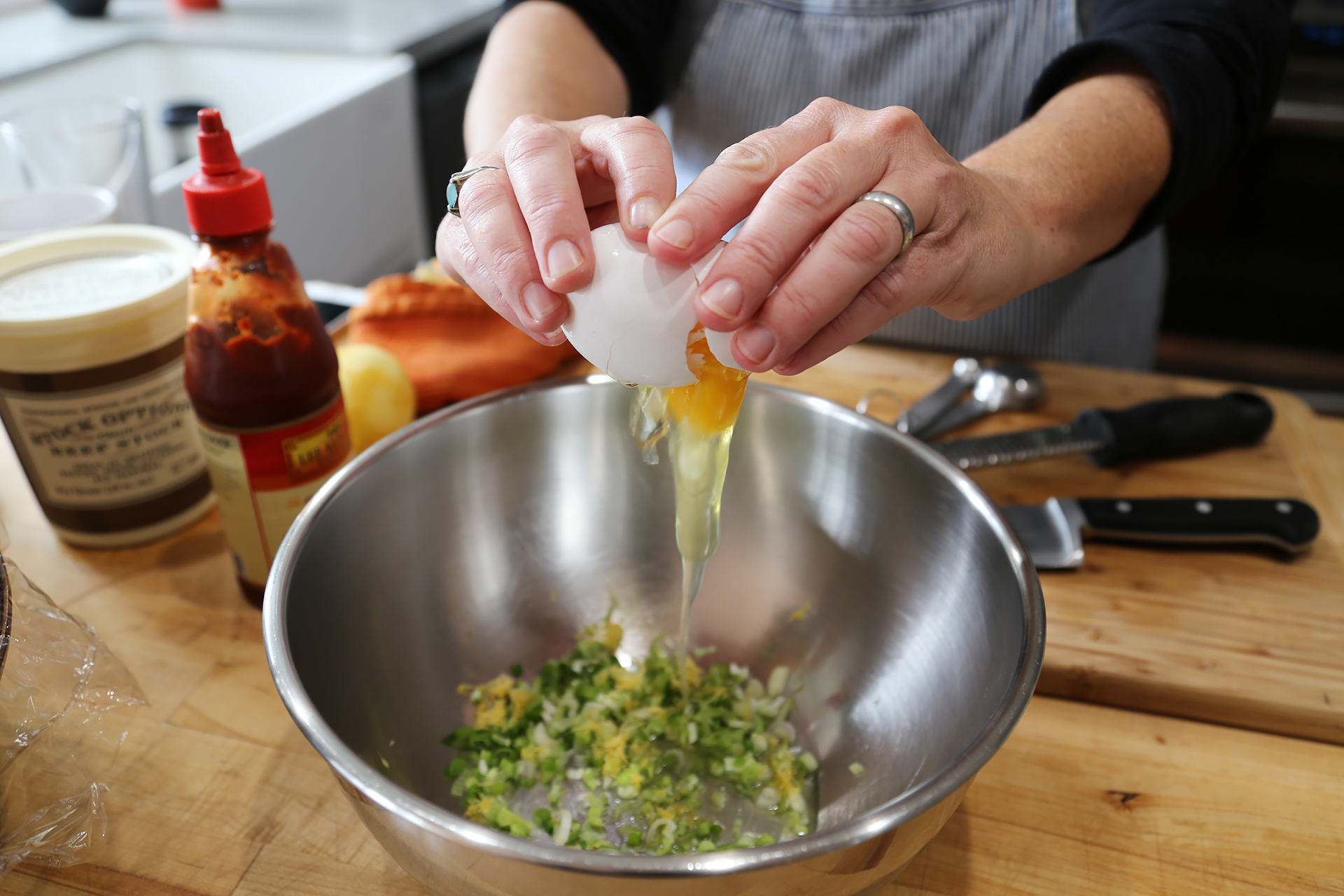 In a medium bowl add the egg, mayo, green onion, parsley and lemon zest, whisk together until combined.