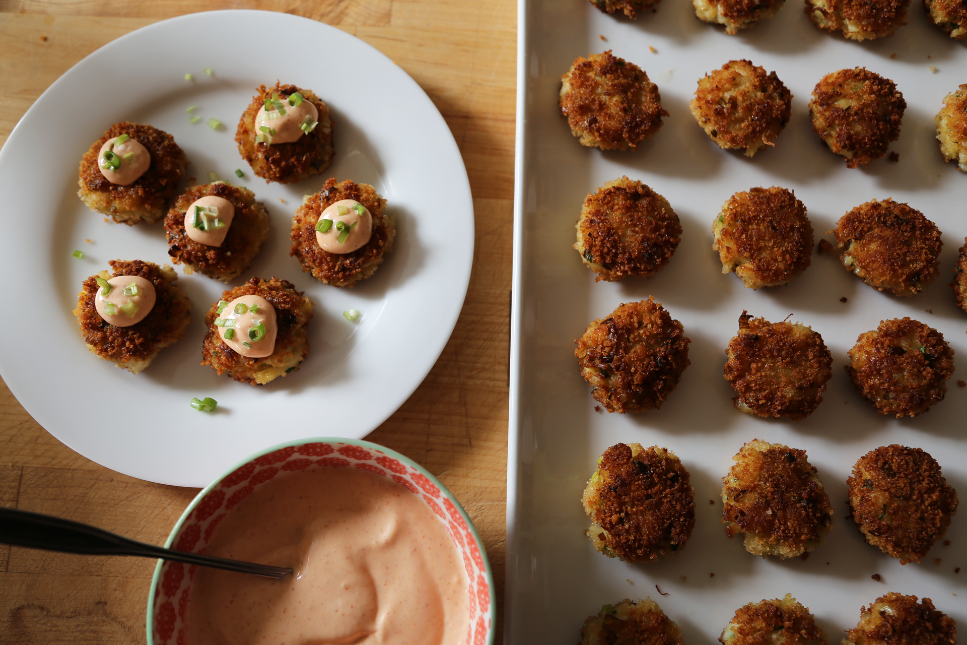 Serve at once with the spicy mayo alongside, or, for passed hors d’oeuvres, place the crab cakes on a platter, top with a little dollop of mayo and a sprinkle of green onion.