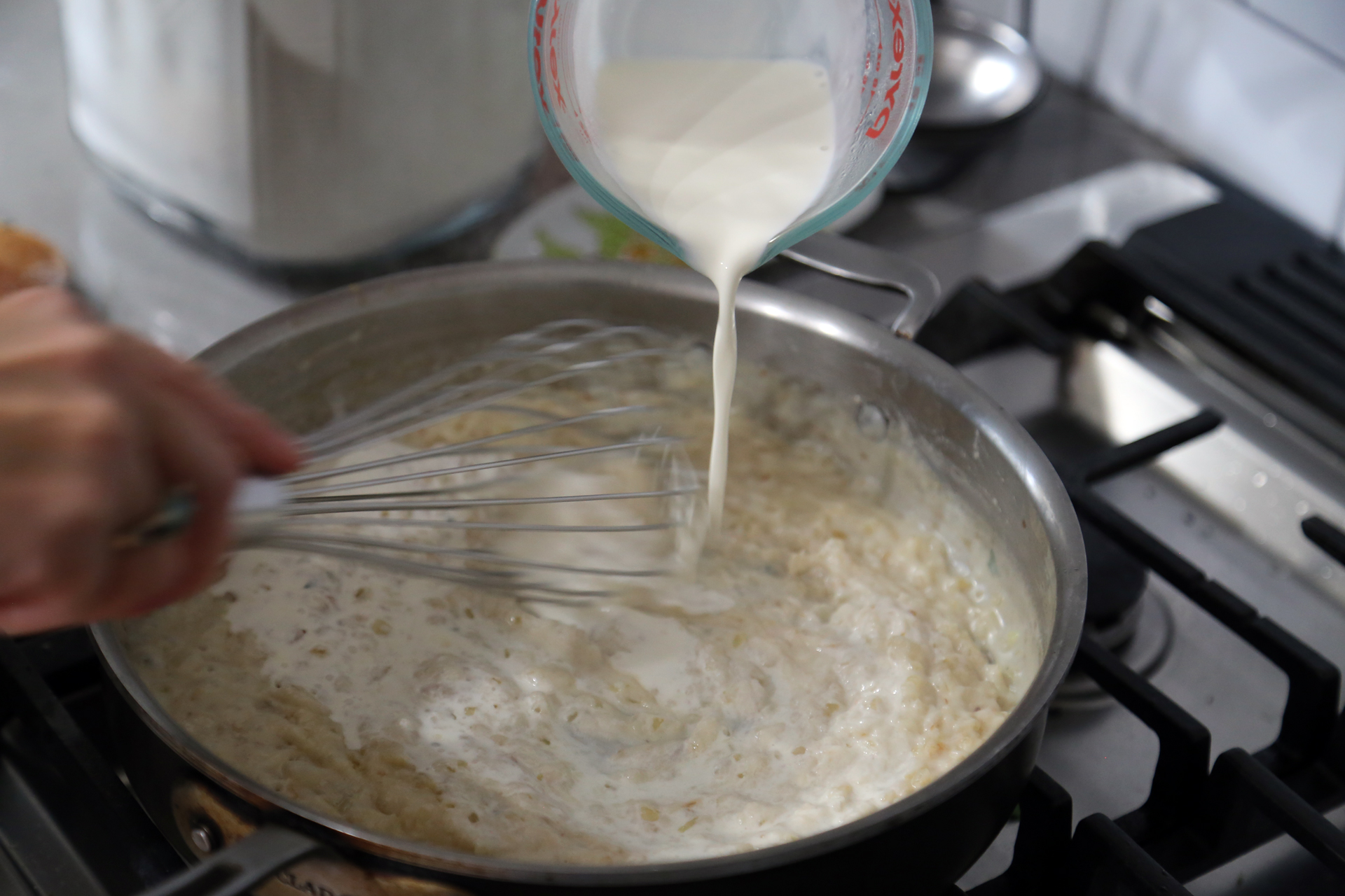 Gradually whisk in the milk, stirring until smooth. Whisk in the cream.