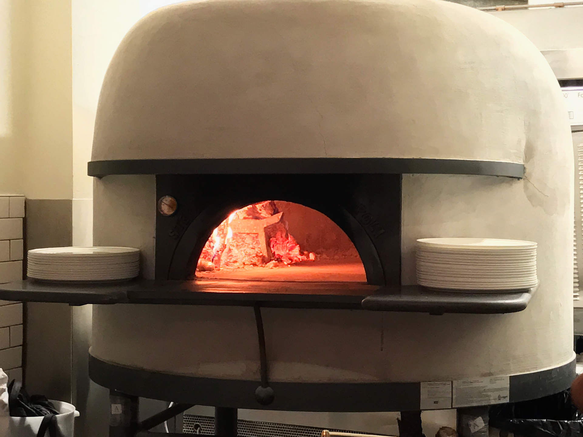 Lucia's handcrafted wood-burning pizza oven made by Sefano Ferrara in Naples.
