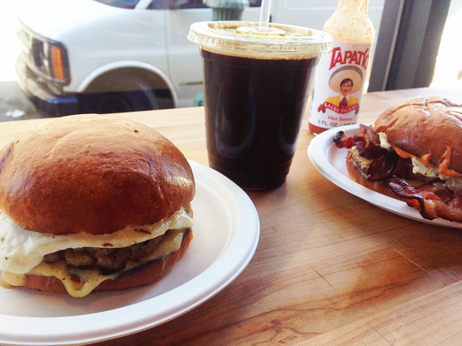 Some of the Gatropig's breakfast sandwich options, and their cold brew.