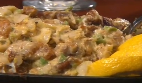 PORK SISIG with onions, jalapeno and egg on a sizzling plate from Patio Filipino