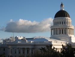 A cloud settles over the state capitol. Photo: Craig Miller