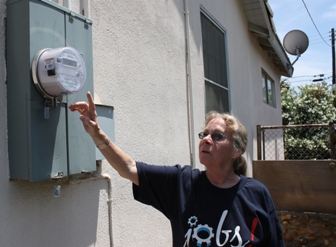Liz Keogh shows me the "SmartMeter" outside her Bakersfield home. Photo: Sasha Khokha