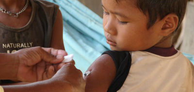 A Cambodian boy receives the measles vaccine.