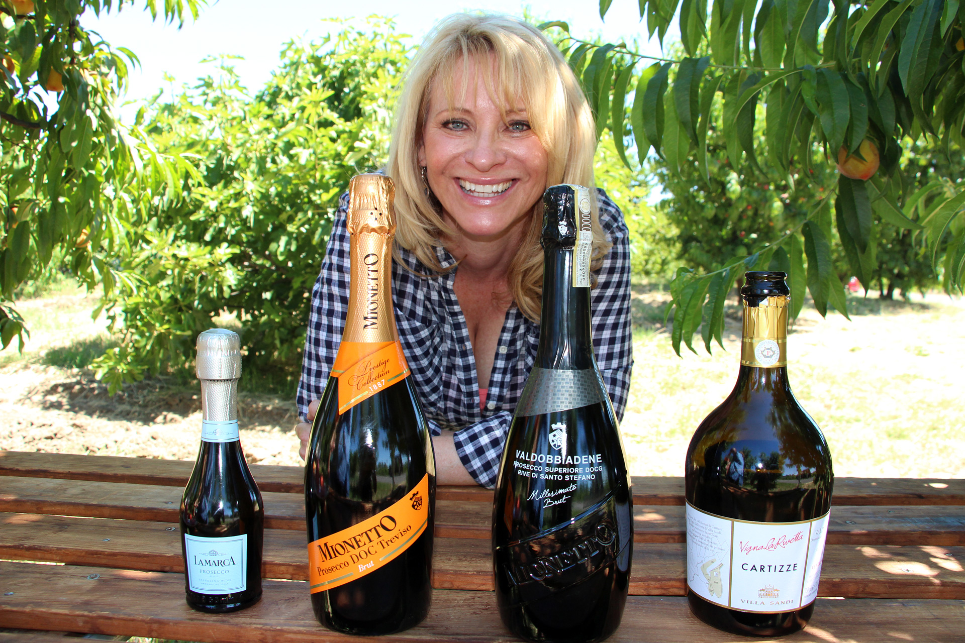 Leslie Sbrocco with Prosecco including DOC and DOCG designations.