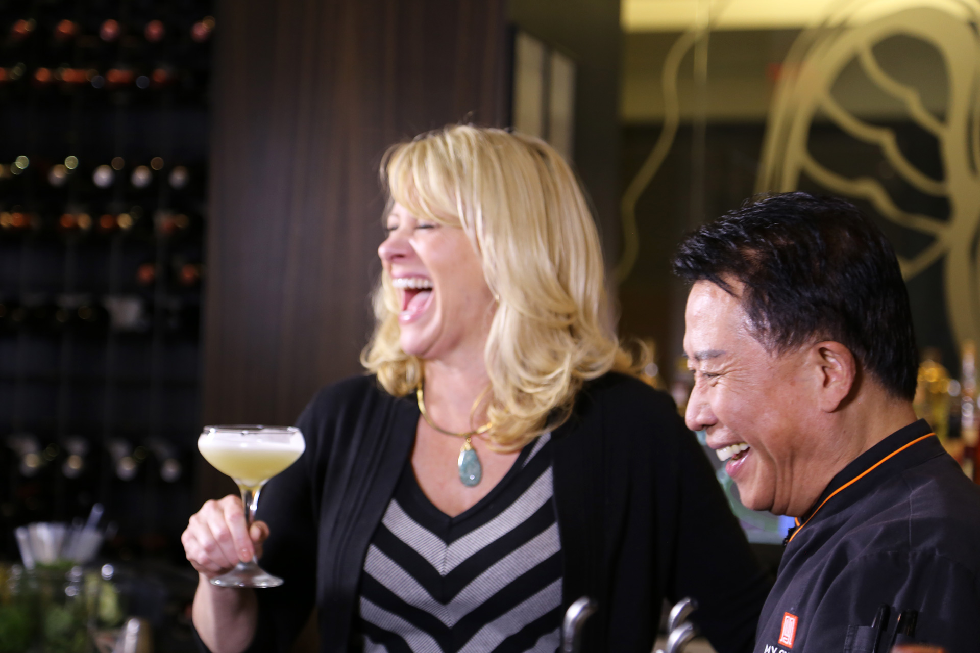 Leslie Sbrocco enjoys Martin Yan's signature East Meets West cocktail at M.Y. China.
