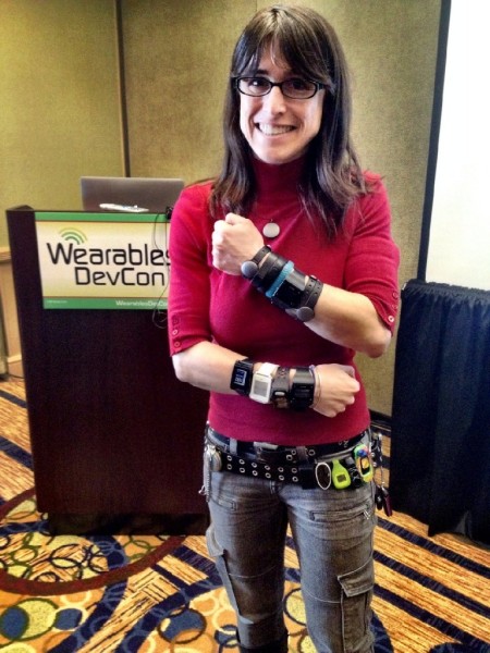 Rachel Kalmar models her activity trackers at the DevCon Wearables Conference. (Credit: DevCon Wearables Conference)