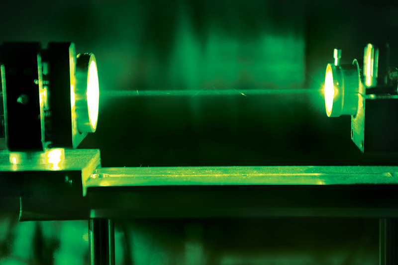 A nanosecond pulsed laser beam starts the photoacoustic imaging process.