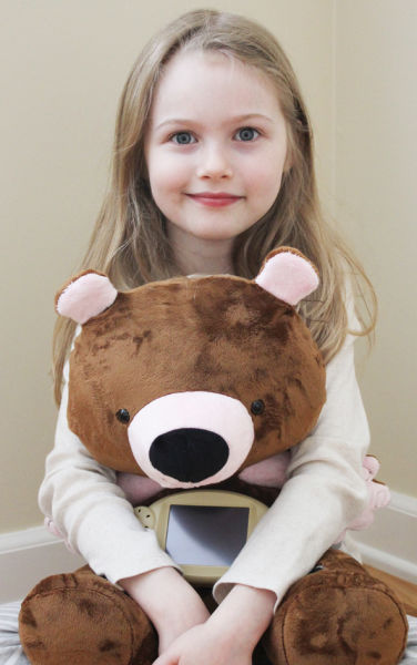 Caylin Proffitt with Jerry, her 'smart' bear and dietary consultant.