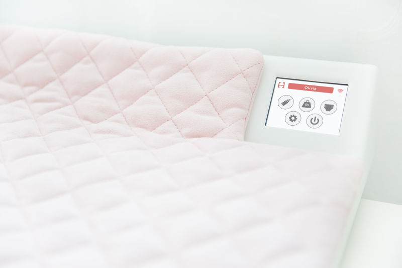 The Smart Pad changing table allows parents to track weight, diaper contents, and other metrics.