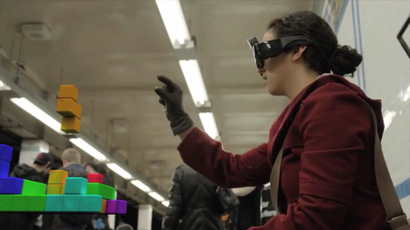This still from a Meta promo video shows how the goggles allow users to manipulate virtual objects.