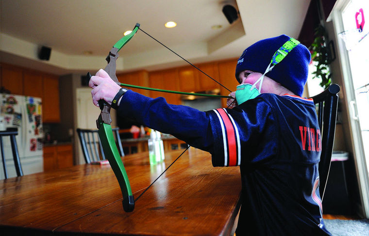 Josh Hardy takes aim at his brother Jude while playing at home. He died in September 2016.