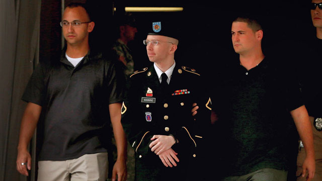Army Pfc. Bradley Manning is escorted by military police as he leaves the first day of closing arguments in his military trial July 25, 2013, in Fort Meade, Md. (Chip Somodevilla/Getty Images)