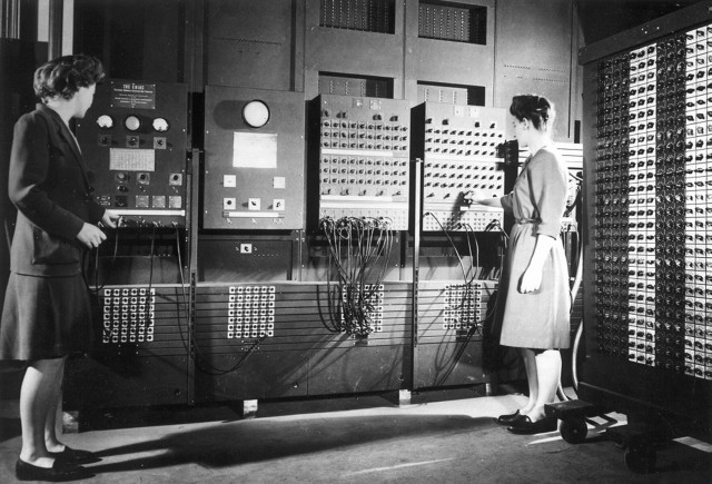 Jean Jennings (left) and Frances Bilas set up the ENIAC in 1946. Bilas is arranging the program settings on the Master Programmer. (Courtesy of University of Pennsylvania)