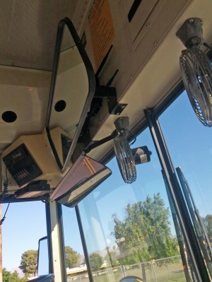A Wi-Fi router is mounted behind the interior driver’s mirror inside this Coachella Valley Unified School District bus. (Credit: Nichole Dobo, The Hechinger Report)