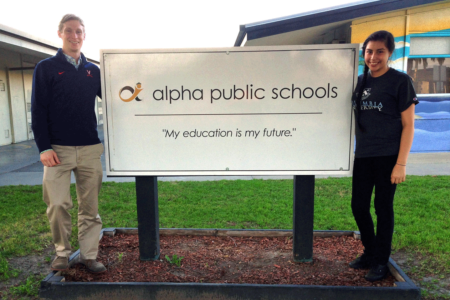 Soon-to-be principal Will Eden, left, and student Ana Wallace, a member of the Alpha: Cindy Avitia High School design team, stand outside one of two Alpha middle schools in East San Jose, Calif. (Photo: Lillian Mongeau)
