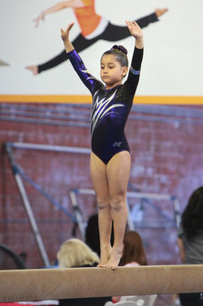Eight-year-old Alyssa Herrera competes in gymnastics.