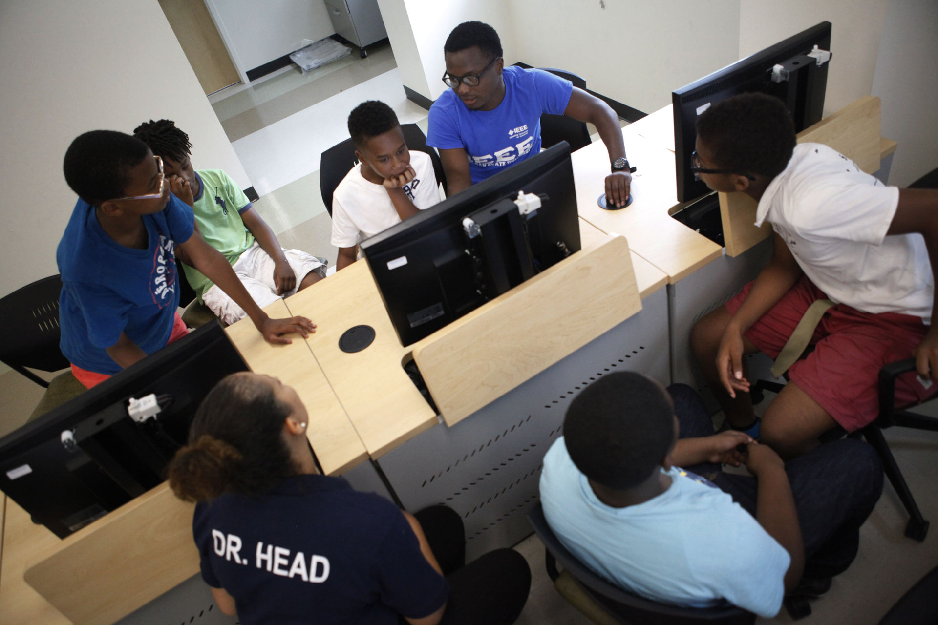 Current Morgan State students work as teaching aides and mentors.