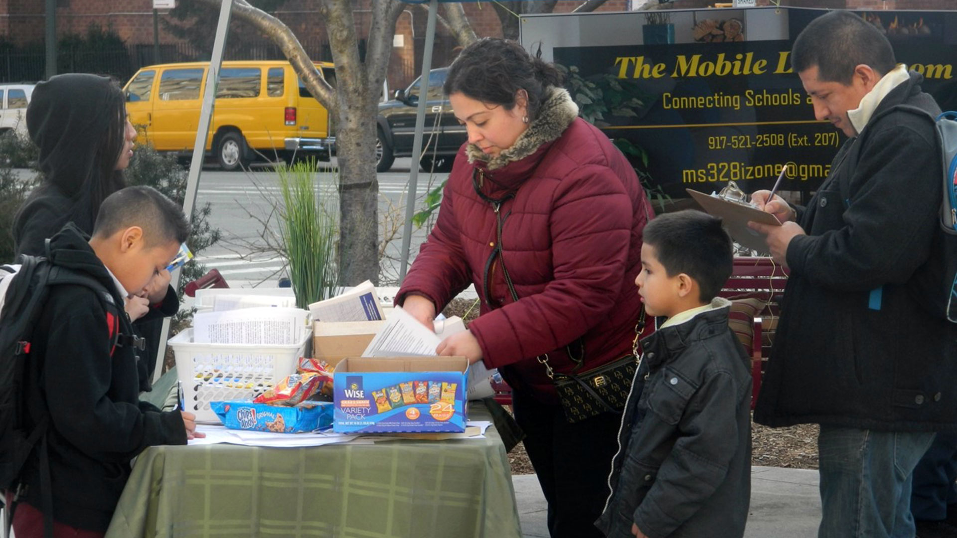 MS 328 staff in Washington Heights tried to engage with parents in a new way by setting up "mobile living rooms" after learning that many parents were hesitant to enter school buildings after negative experiences there.