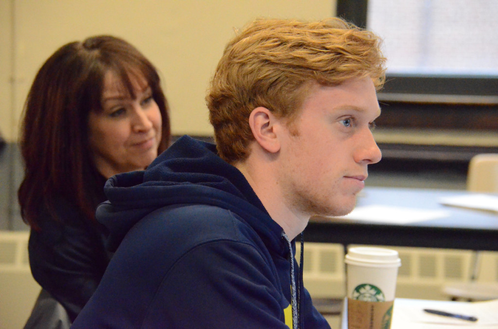 Lucien Gerondeau, a student in the Secondary Teacher Education program at the University of Michigan. Behind him is Elizabeth Moje, a professor and associate dean. 