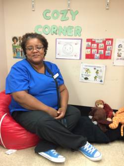 Terry Walker, known to her preschoolers as Miss Terry, sits in her Bridgeport classroom's Cozy Corner. The space is meant to help the children manage their own big feelings.