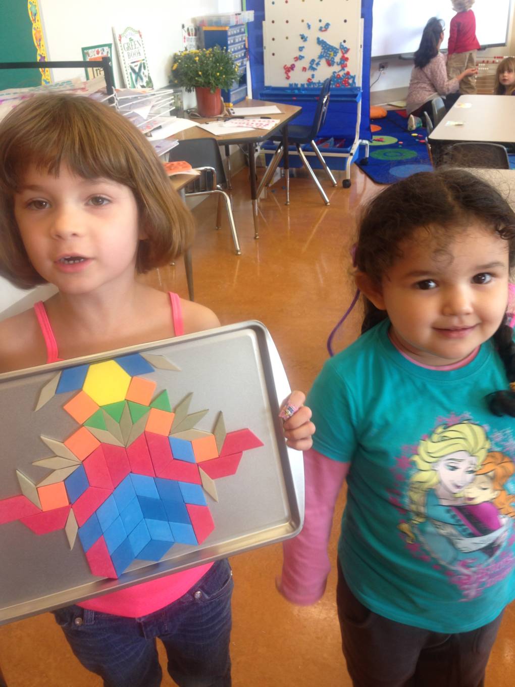 Students in Cristol Bailey's early years class show off their symmetry.
