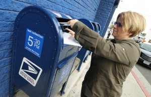 A woman rushes to mail her tax returns