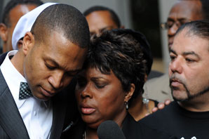Wanda Johnson, the mother of Oscar J. Grant III, was comforted by her supporters outside the Los Angeles Superior Court after Johannes Mesherle was sentanced to voluntary manslaughter.  Mark Ralston/AFP/Getty 