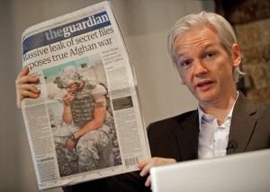 Julian Assange, leader of WikiLeaks, holds up a copy of the Guardian with a front page article that used leaked Pentagon data. Leon Neal/AFP/Getty