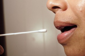 California law mandates that all those arrested — whether charged with a crime or not — should submit to a cheek swab. (William Thomas Cain/Getty Images)