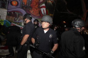 Police officers entered the plaza in riot gear and carrying billy clubs. photo by Grant Slater/KPCC
