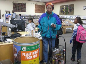 A patron donates food at the East Palo Alto Library. (Photo by: San Mateo County Library)