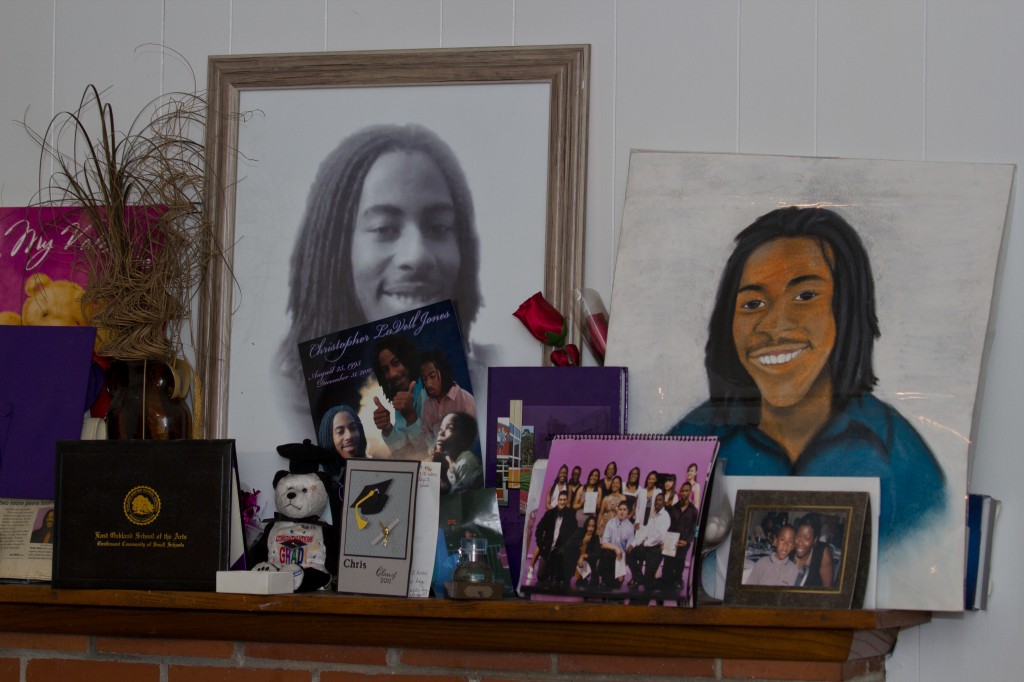 In Brenda Grishams home, photos and momentos of her son Christopher Jones, fill the mantel.  Jones was murdered on the front porch of their home on December 31, 2010.  Photo by Deborah Svoboda / KQED