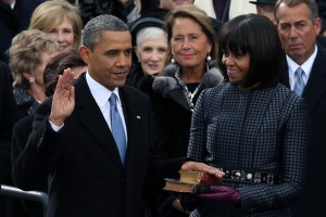 Barack Obama is sworn in during the public ceremony as First lady Michelle Obama looks on (Alex Wong/Getty Images)