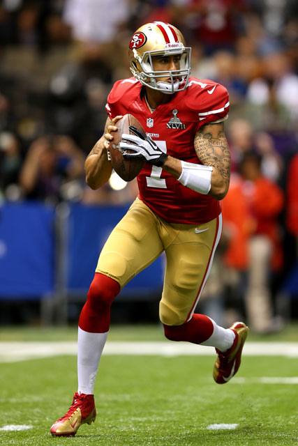 Colin Kaepernick in the first quarter. (Mike Ehrmann/Getty Images)