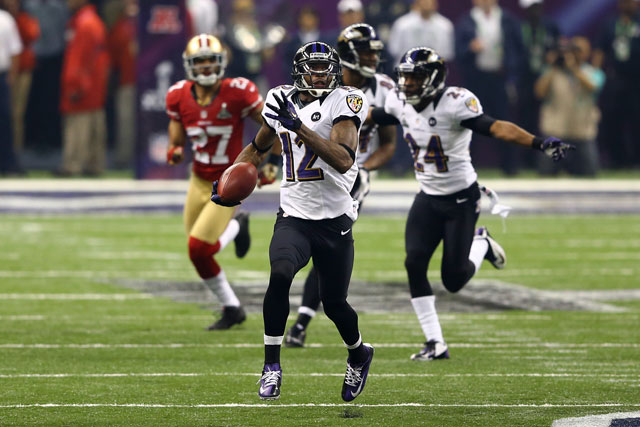 Jacoby Jones runs back a record 109-yard kickoff return for a touchdown in the third quarter. (Al Bello/Getty Images)