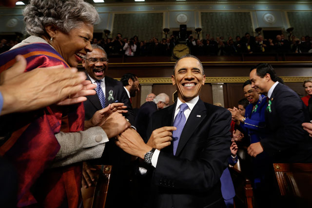 President Barack Obama is greeted before his State of the Union. (Charles Dharapak-Pool/Getty Images)