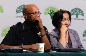 Oakland police chief Howard Jordan (L) and Oakland Mayor Jean Quan pause during a press conference about Occupy Oakland in 2011, a low point in Quan's approval ratings.  Oakland Mayor Jean Quan held a press conference to address police action taken on Occupy protesters who staged a demonstration in downtown Oakland. (Photo by Justin Sullivan/Getty Images)