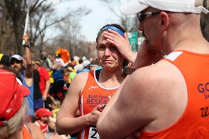 A runner reacts near Kenmore Square after two bombs exploded during the 117th Boston Marathon. (Alex Trautwig/Getty Images)