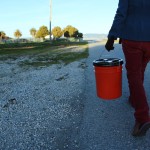 Reporter Katharine Mieszkowski carries buckets containing carefully separated soil samples from Treasure Island, which later were tested at two independent certified radiation labs.(Kerri Connolly/Center for Investigative Reporting)
