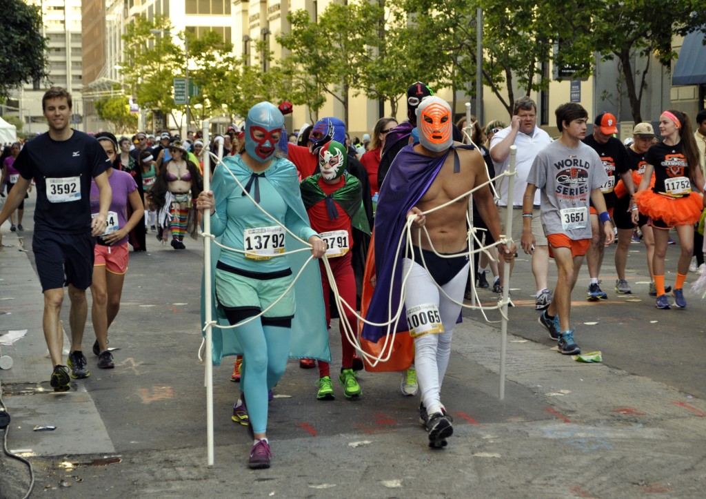 Runners dressed in lucha libre costumes (Lauren Benichou/KQED) 