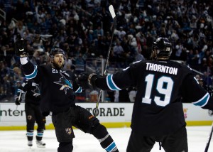 Joe Thornton (No. 19) congratulates T.J. Galiardi (No. 21) of the San Jose Sharks after Galiardi scored a goal in game 6 of their series against the Los Angeles Kings. (Ezra Shaw/Getty Images) 
