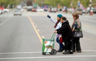 Seniors cross Alum Rock Avenue near the Eastside Neighborhood Center in San Jose.(Noah Berger/Center for Investigative Reporting)