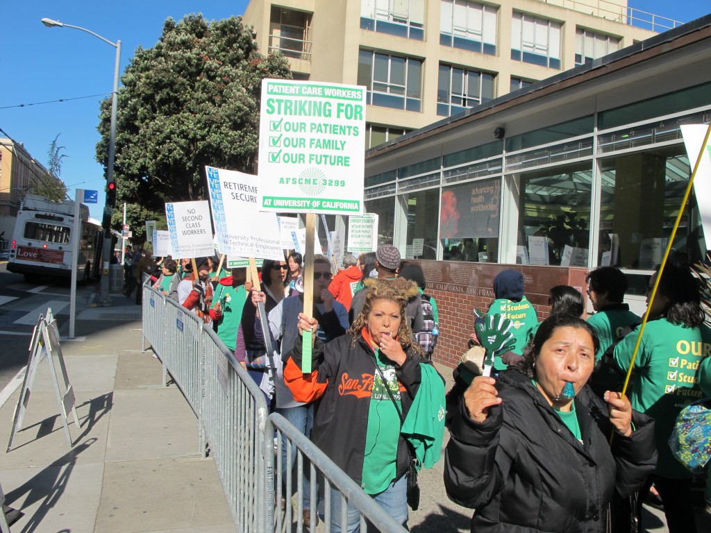Striking workers whistled on the picket line at UC San Francisco. (Andrew Stelzer/KQED)