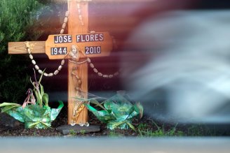A wooden cross at the intersection of Clayton Road and Barbis Way in Concord memorializes the death of Jose Flores Miguel. (Adithya Sambamurthy/Center for Investigative Reporting)