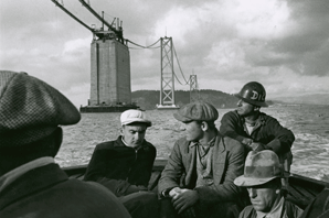 Men head home early after a death during construction of the Bay Bridge. Photo: Peter Stackpole, Quitting Time, 1935. 