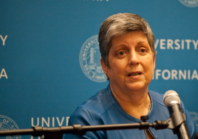 Janet Napolitano speaks to the press in July as students protest her selection as president outside. (Photo by Deborah Svoboda/KQED)